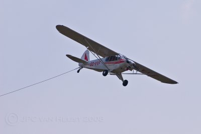 Piper PA18-150 Super Cub picking up a banner
