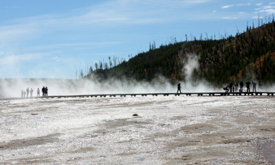 Silhouette of people on the boardwalk at Midway Geyser Basin