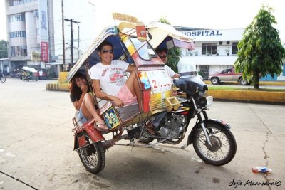 THINGS ARE LOOKING UP! Out on a travel adventure, my fellow lifestyle columnist Jinggoy Salvador (front, sitting in his 6 foot frame) and I (at the back) looked skyward as we boarded a typical tricycle in Pagadian City, capital of Zamboanga del Sur. Our driver told us not to fear, for these are heavy duty vehicles pointing upwards in mobile. I asked fellow writer Claire Dy to take photos of us from my camera. Up, up and away!