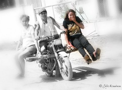 My first taste of the local transportation called SKYLAB (motorcycle with wood planks tied together as passenger seats), a death defying experience in Surigao del Sur back in 2008 (in photo is Surigao del Sur Provincial Tourism Officer Lala Ambray. Please see my back view in another photo. 
