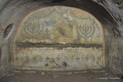 Lulav, menorah, flask of oil, temple in Jerusalem (or the Aron), shofar, knife and ethrog