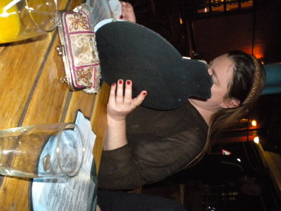 Me hiding behind a menu at the pub.jpg