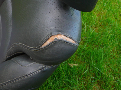 92 Lebaron Driver Side Leather Seat - Panels seperated near head rest.