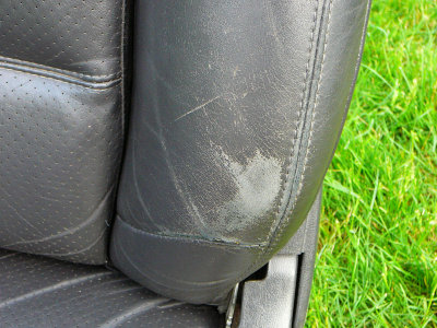 92 Lebaron Driver Side Leather Seat - Bolster, worn but not near thru.