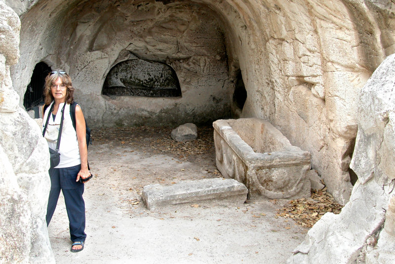 Bet Shearim: Judy in the entrance to the burial Cave of the Lone Sarcophagus, with a courtyard - in the necropolis.