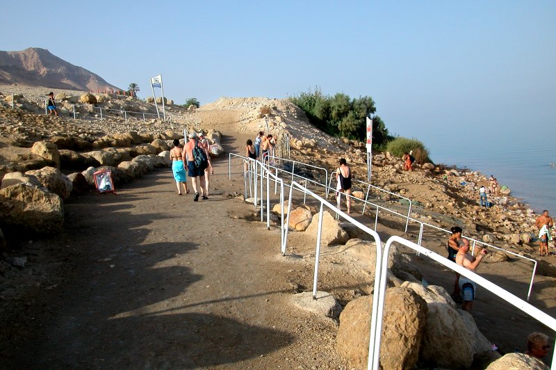 Judy (black bathing suit at the very top of the ramp) heading for the shower to wash off the salt after being in the Dead Sea.