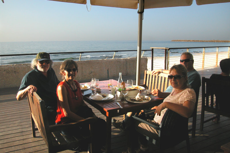 We were having dinner on the promenade next to the beach on the Mediterranean Sea in Tel Aviv.