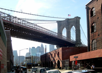 The Brooklyn Bridge - seen from Water St. looking northwest - the DUMBO section of Brooklyn. Manhattan is in the background.