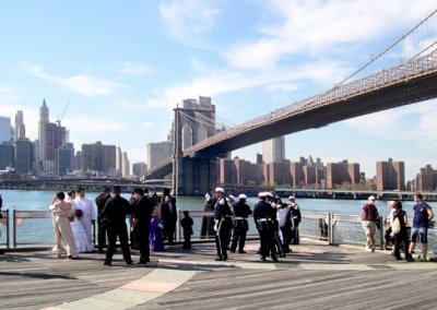 Two wedding parties at the Fulton Ferry Landing Pier in Brooklyn - foreign soldiers are in one wedding party.