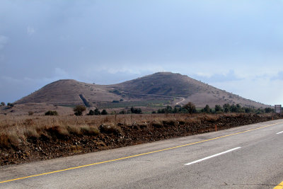 Back road leading to Syria - between two elevated areas - off of a main road - in the Golan Heights