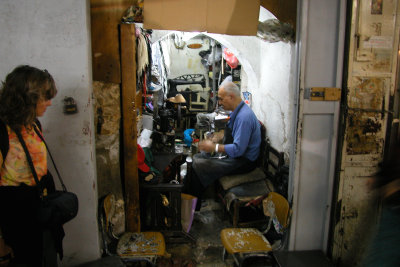 Jerusalem: Judy observing a tailor in an indoor Arab market in the Muslim Quarter of the Old City.