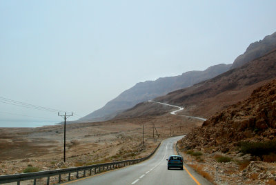 Driving south to Masada through the Judean Desert. The Dead Sea is in the background.