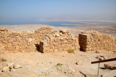 Top of Masada: Part of the wall surrounding Masada with the Dead Sea and mountains in Jordan in the background.