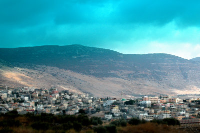 An Arab village: Several mosques and minarets are visible. We drove through this village.