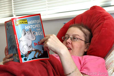 Melly reading Dr Seuss to Casper