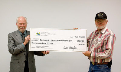 Jeff Parsons presenting BCHW President Bob Gish the big check
