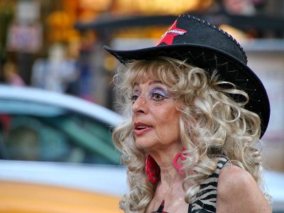 Naked Cowgirl posing for pics in Times Square