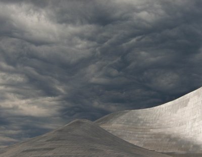 Roof and clouds- Frank Gehry's Fisher Performing Arts Center, Bard College.jpg