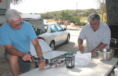 Barry and Steve Cleaning Fish