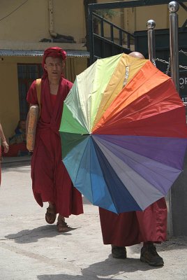 Tibetan Monk with Rainbow Umbrella