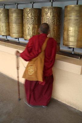 Tibetan Monk Turning Mani Prayer Wheel 02