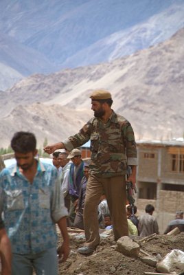 Armed Soldier Controlling Crowd Leh