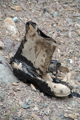 Abandonned Boot Covered in Tar