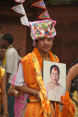 Boy Dressed as Cow with Photo of Dead Relative Gai Jatra