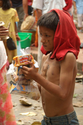Young Boy with Gifts Gai Jatra