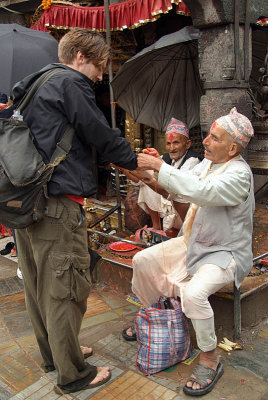 Brahmin Tying Thread on Tourist Durbar Square