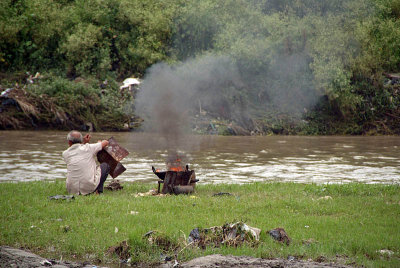 Man Burning Rubbish by Bagmati River