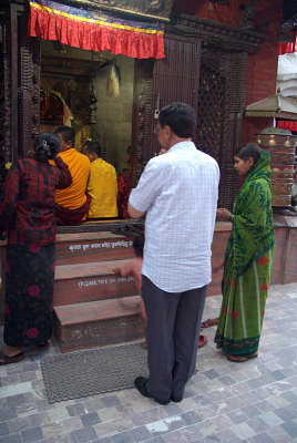Praying at Small Gompa Boudha Stupa.jpg