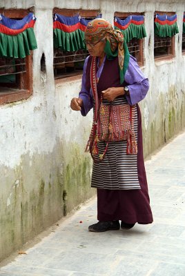 Tibetan Lady and Prayer Wheels