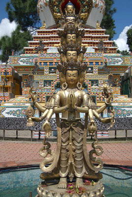 Statue in front of 1000 Buddha Stupa Detail Kopan Monastery