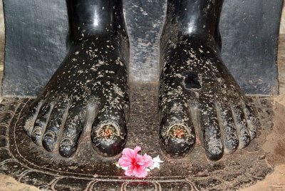 Offering at Feet of Jain Statue Sravana#