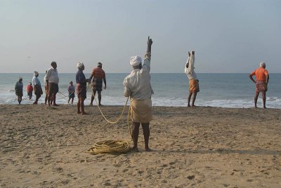 Fishermen Pulling in Nets Black Beach 03