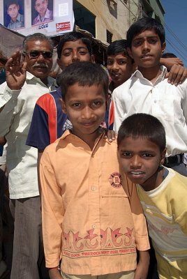 Boys and a Waving Passer-By Bijapur Market
