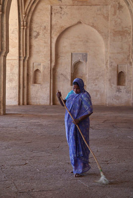 Woman in Purple Sweeping Ibrahim Rouza