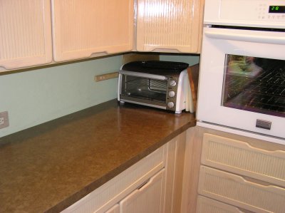 Countertop with  Kenmore Convection Toaster Oven and Frigidaire Wall Oven