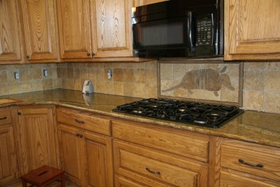 Finished the rest of the backsplash with the travertine