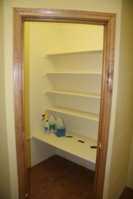 Laundry closet shelving and trim are done