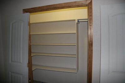 Front bedroom closet shelves and trim