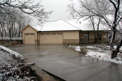 The new driveway and the first snow on the house