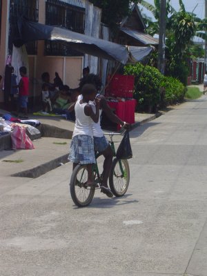 Garifuna kids sharing a bike in Livingston