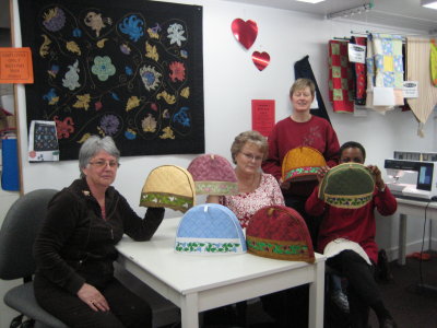 Embroidery workshop - a whole team of tea cozies!