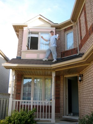 Pete paints the upstairs windows