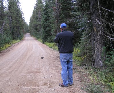 Greg Baker gloating over  spruce grouse (10/10/2009)