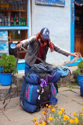 Porters preparing to carry our packs.jpg