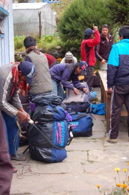 Porters preparing to carry our packs_2.jpg