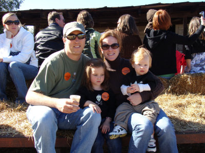 The Family out picking pumpkins